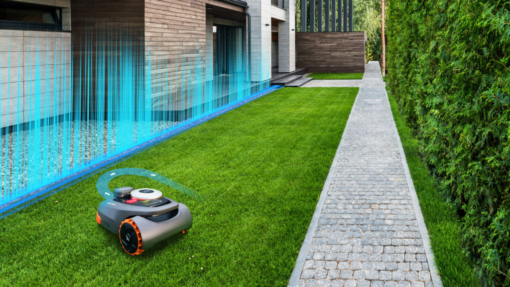 Segway Navimow H-Serie Mähroboter mäht einen schmalen Rasenstreifen präzise entlang eines Gehwegs – ideal für moderne Gärten.