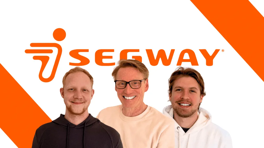 Teamfoto vor Segway-Logo – engagiertes Navimow Vertriebsteam für kabellose Mähroboter in Deutschland.